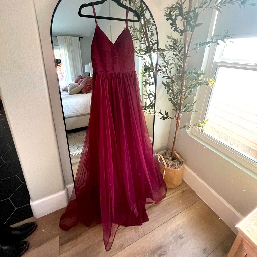 Burgundy dress. Only worn for about an hour for family pictures. Like new.